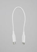 A white USB-C to Lightning cable shown against a solid black background.