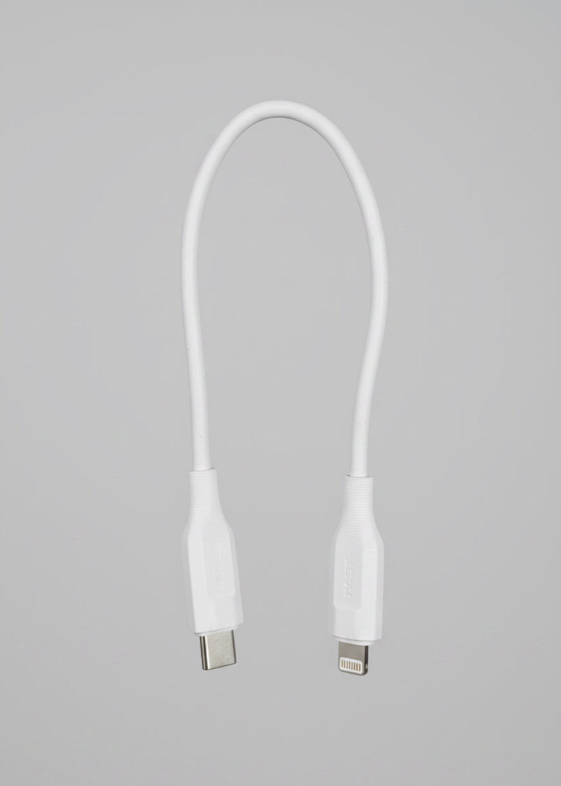 A white USB-C to Lightning cable shown against a solid black background.